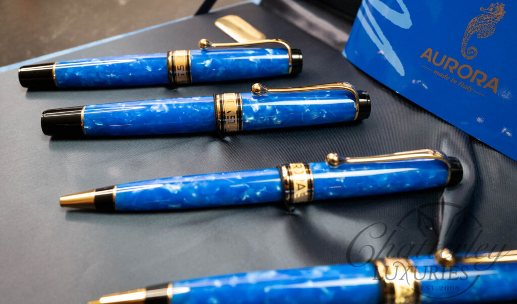 Aurora fountain pens handcrafted in Turin Italy featuring 18K gold nibs and marbled blue Auroloide resin